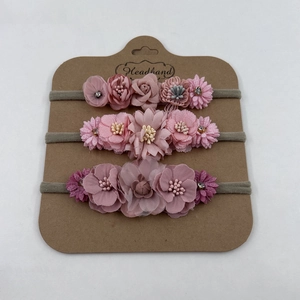 Three-piece set of baby flower headbands with pink fabric roses and elastic bands