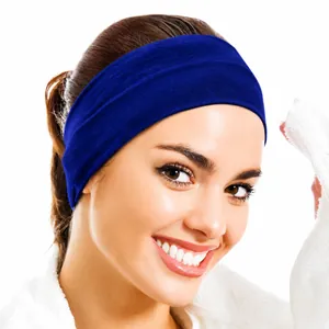 Detail view of a dark blue elastic wide headband for skincare and sports use