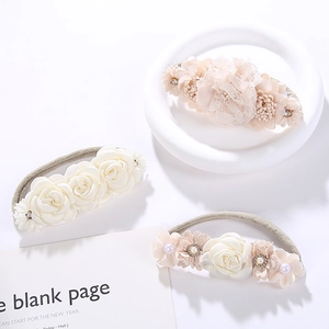 Three-piece set of sweet floral infant headbands with lace and pearls in beige and pink