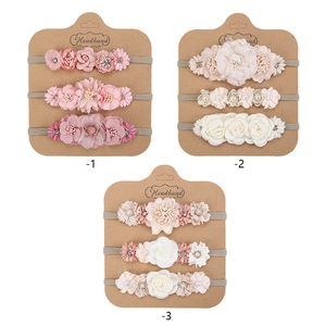 Three sets of sweet artificial flower headbands for baby girls in pink and beige tones