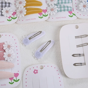 Lot de 4 pinces à cheveux marguerites en tissu aux couleurs douces pour filles