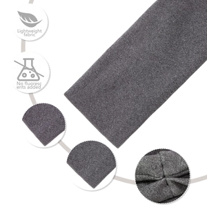 Detail showing the lightweight grey knitted fabric texture and elastic pleat craftsmanship