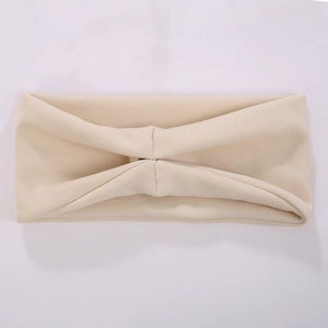 Elastic beige knit headband with twist knot design for skincare and facial washing