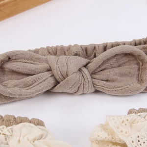 Detailed macro view of cotton linen rabbit ear headbands with lace textures and waffle fabric