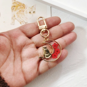 Golden moon and cat keychain with real red dried flowers in transparent resin