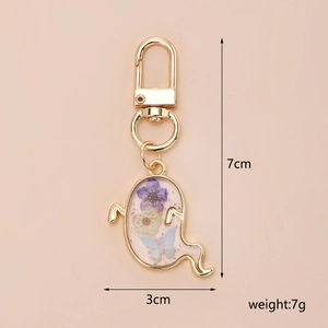 Ghost Halloween keychain with dried flowers and blue butterfly, 7cm height detailed view