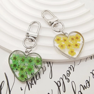 Handmade heart resin keychain featuring real pressed dried flowers with silver lobster clasp