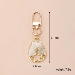 Cat ear resin pendant with dried flowers and gold leaf, 7.1cm x 2.6cm size detail