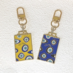 Porte-clés vintage œil maléfique bleus et jaunes avec gravure dorée I SEE YOU