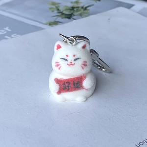 Cute white flocked lucky cat keychain with red Good Luck scroll and silver metal ring