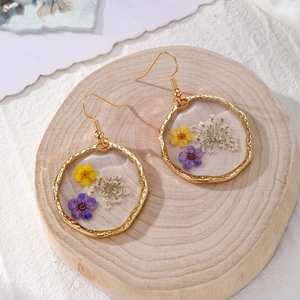 Handmade dried flower resin earrings with irregular gold hoops and natural floral petals