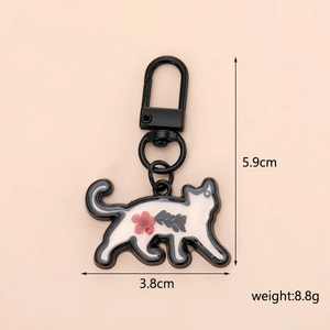Cat shaped keychain with dried flower pattern showing dimensions 5.9cm by 3.8cm