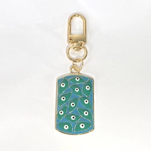 Golden square Evil Eye keychain with blue enamel drips and bohemian geometric patterns