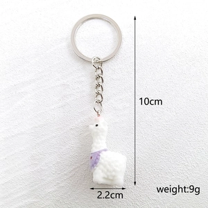 Detailed view of miniature alpaca keychain showing 10cm height and 2.2cm width dimensions