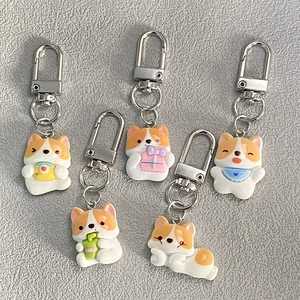 Set of five cute resin Corgi dog keychains in various poses for bag charms and gifts