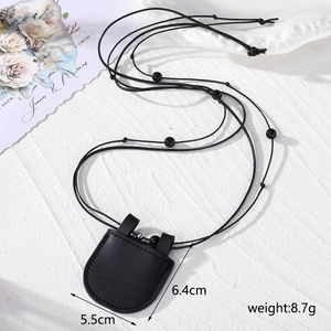 Close-up of black PU leather mini bag necklace with size labels 5.5cm by 6.4cm