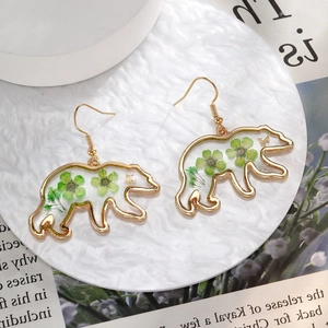 Creative polar bear drop earrings with green dried flowers in gold metal frame