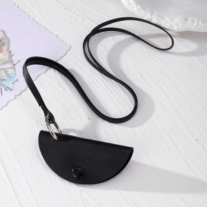 Detail shot of the black faux leather key holder bag with silver ring and neck strap