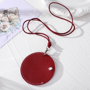 Red circular leather sunglasses clip and mini neck bag with stylish white stitching detail
