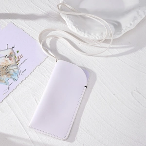 Minimalist white faux leather crossbody phone bag with slim flap and refined texture