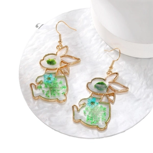Golden bunny drop earrings with blue and green dried flowers inside transparent resin