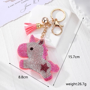 Porte-clés licorne étincelant avec pompon rose et cloche dorée mesurant 15,7 cm sur 8,8 cm