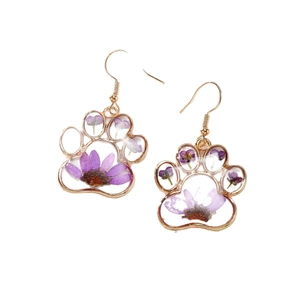 Purple dried flower earrings in gold cat paw frame with transparent resin filling