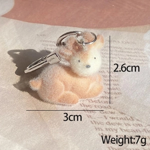 Detailed macro view of a 3cm mini flocked deer keychain pendant with dimensions and weight