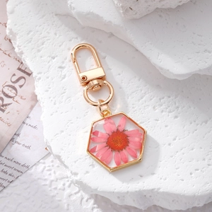 Creative hexagonal daisy resin keychain with real pink dried flowers and gold frame