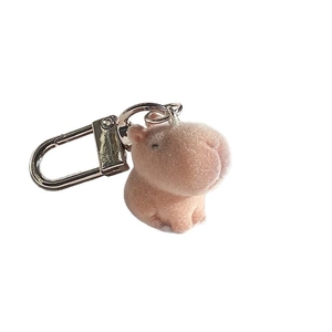 Cute pink flocked capybara keychain with a round shape and silver metal D-ring hook