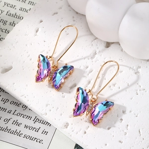 Elegant butterfly drop earrings with purple crystal wings and gold-plated hooks