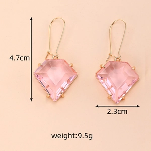 Detailed view of pink crystal earrings featuring geometric facets and measurements