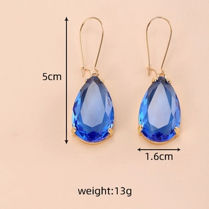 Elegant gold drop earrings with large faceted navy blue crystal pendants in 5cm length
