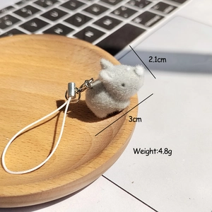 Close-up of a 3cm flocked animal charm with dimensions 2.1cm and weight 4.8g listed