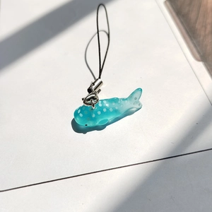 Cute polka dot blue whale charm pendant with translucent finish and black cord lanyard