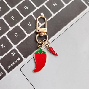 Realistic red chili pepper keychain with green leaves and golden lobster clasp