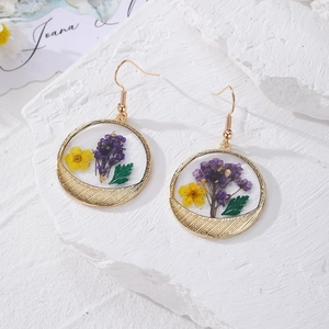 Floral stainless steel earrings with real purple and yellow dried flowers in gold frames