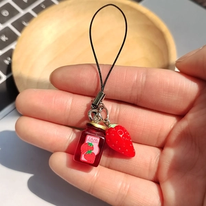 Creative handmade keychain featuring realistic resin strawberry and jam bottle charm