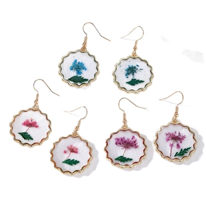 Handmade dried flower resin earrings with gold scalloped edges in blue, pink and purple