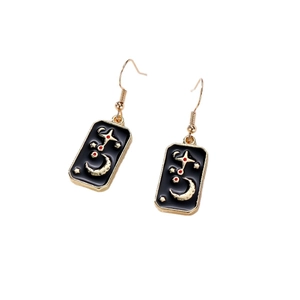Celestial tarot earrings with gold moon and star patterns on black enamel dangle drop