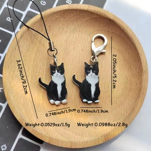 Set portachiavi gatto bianco e nero in acrilico con dimensioni e peso dettagliati