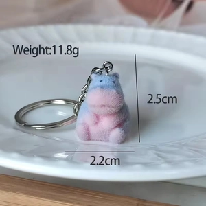 Detail of blue and pink gradient flocked hippo keychain with metal chain and dimensions