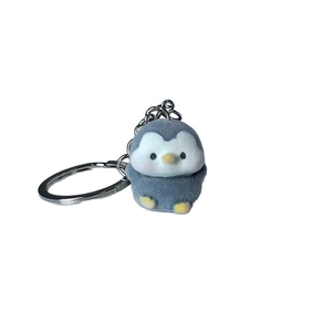 Cute gray flocked penguin keychain with yellow accents and a silver metal ring