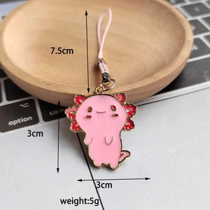 Detail of pink axolotl enamel charm showing 3x3cm size and 7.5cm woven lanyard strap