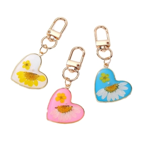 Handmade heart-shaped resin keychains with colorful real dried flowers and gold clasp