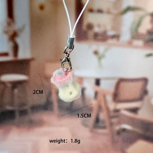 Detail view of pink and yellow flocked heart apple keychain with dimensions and weight