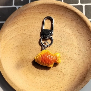 Creative resin taiyaki fish biscuit keychain with realistic scale texture and metal clasp