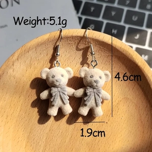 Detail view of flocking bear earrings with size 4.6cm by 1.9cm and weight 5.1g