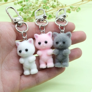 Cute flocked kitty keychains in white, pink, and grey with silver metal clips