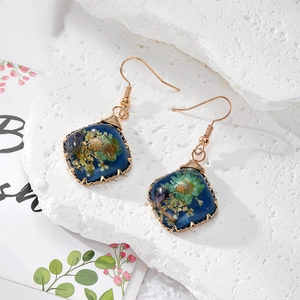 Blue resin earrings with real dried flowers and gold wire wrapped stainless steel hooks